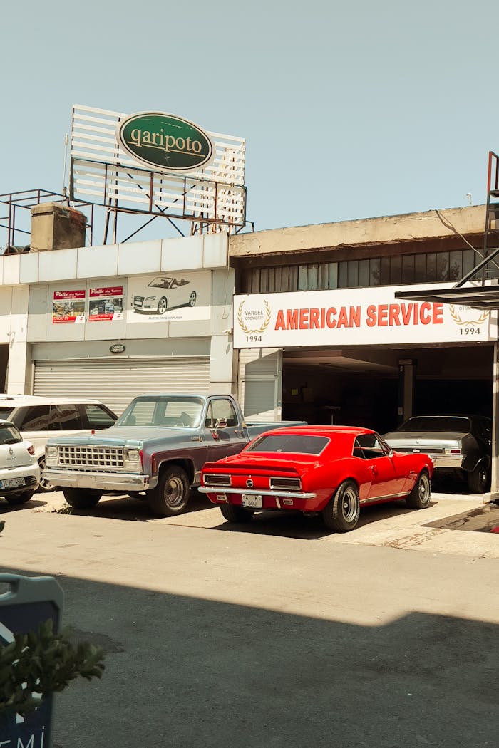 The Art of Drawing Readers In: Your attractive post title goes here Vintage cars at an urban garage offering American car repair services.